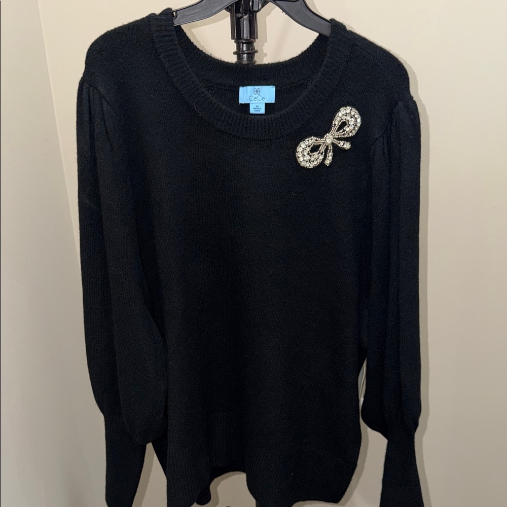 CeCe Black Crewneck Sweater with Rhinestone Bow Brooch